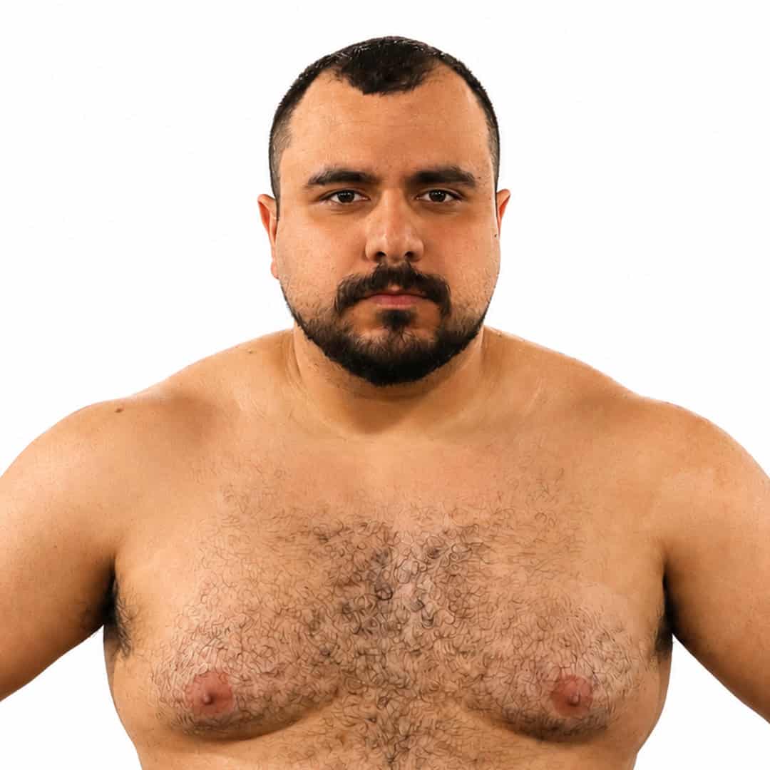 Close-up of a sumo wrestler with a serious expression.
