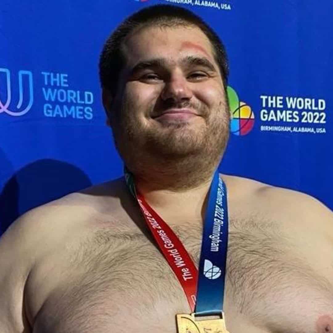 Sumo wrestler smiling with medal at the 2022 World Games.