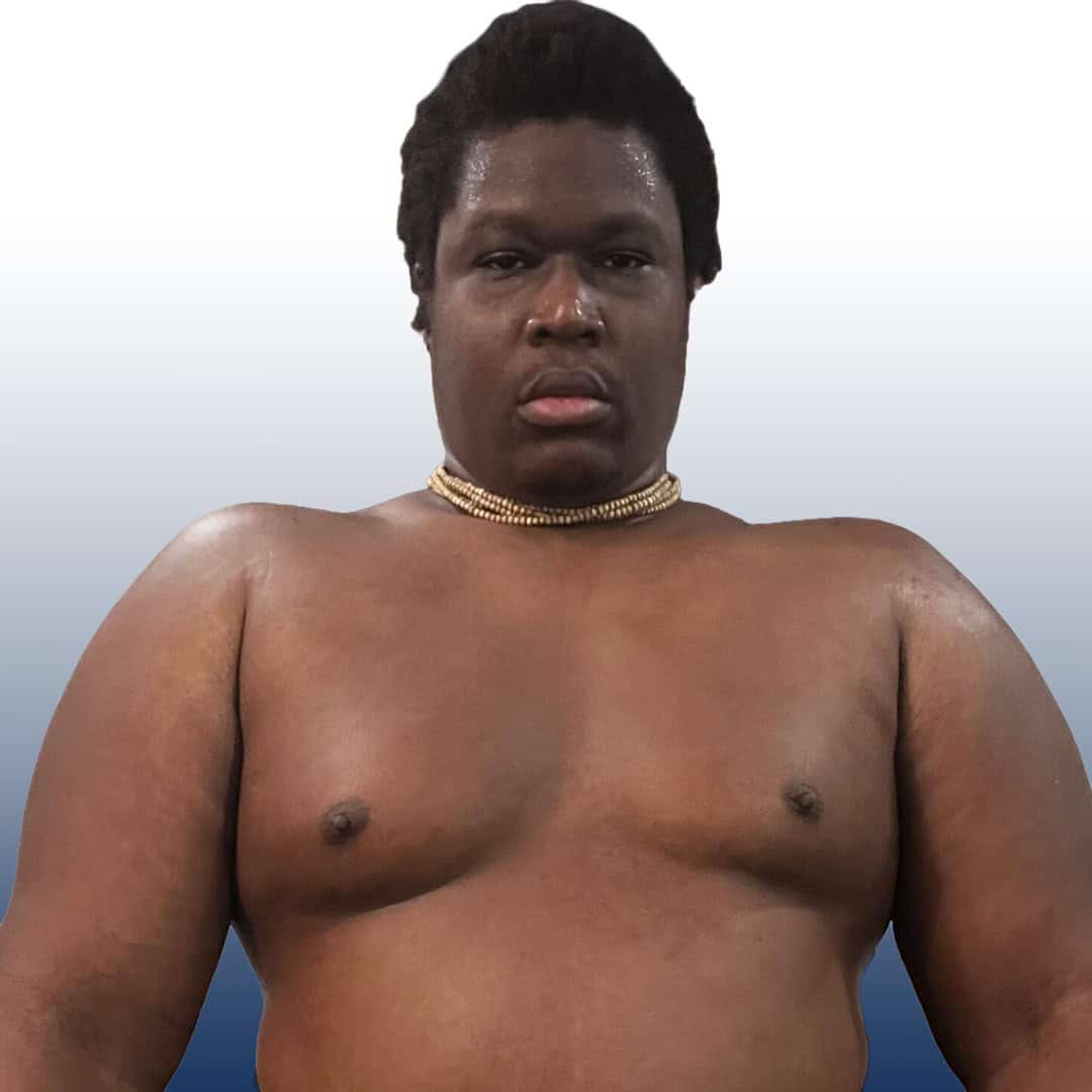 Close-up of a sumo wrestler with a serious expression.