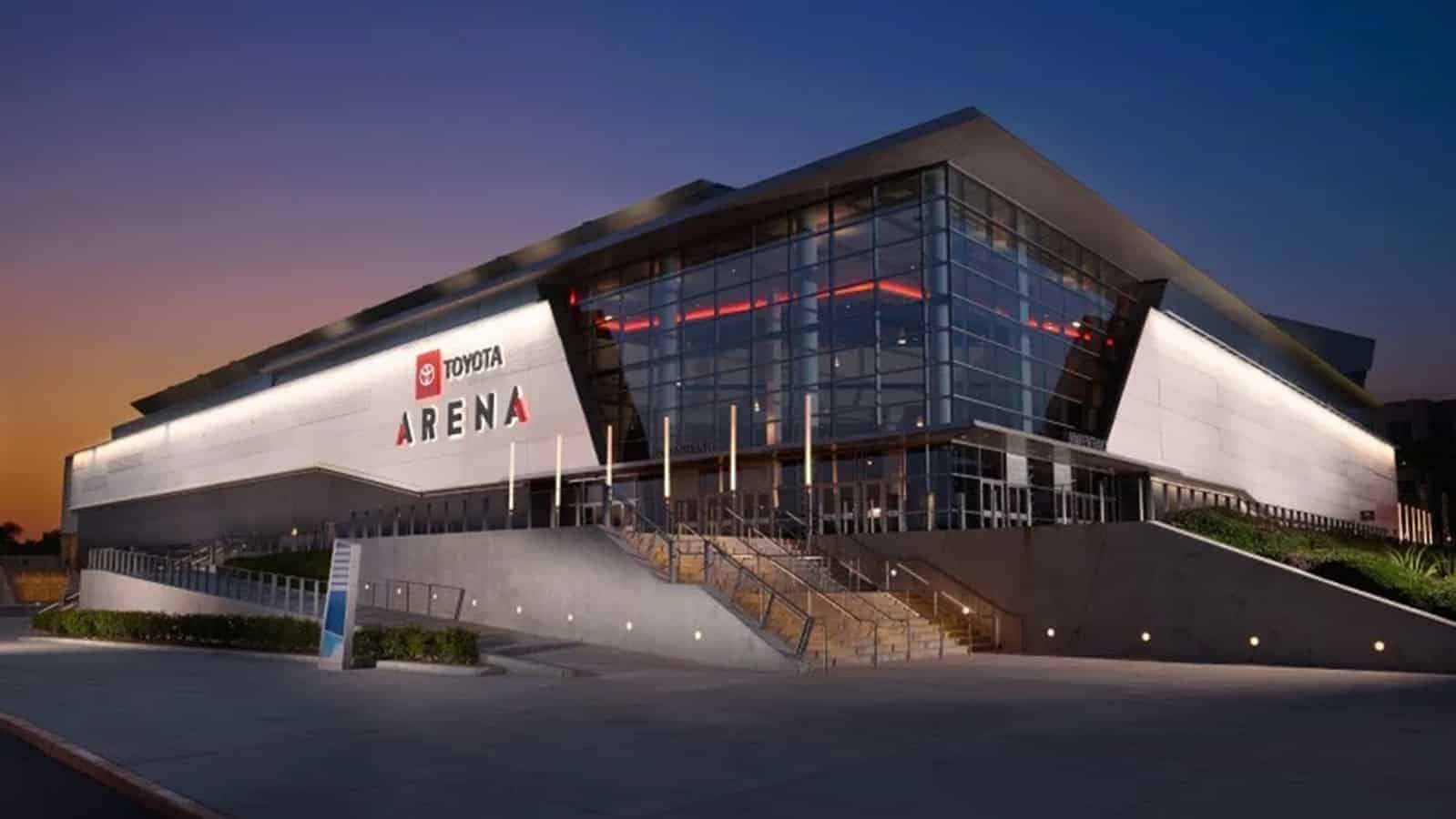 Exterior view of Toyota Arena at dusk with illuminated signage.