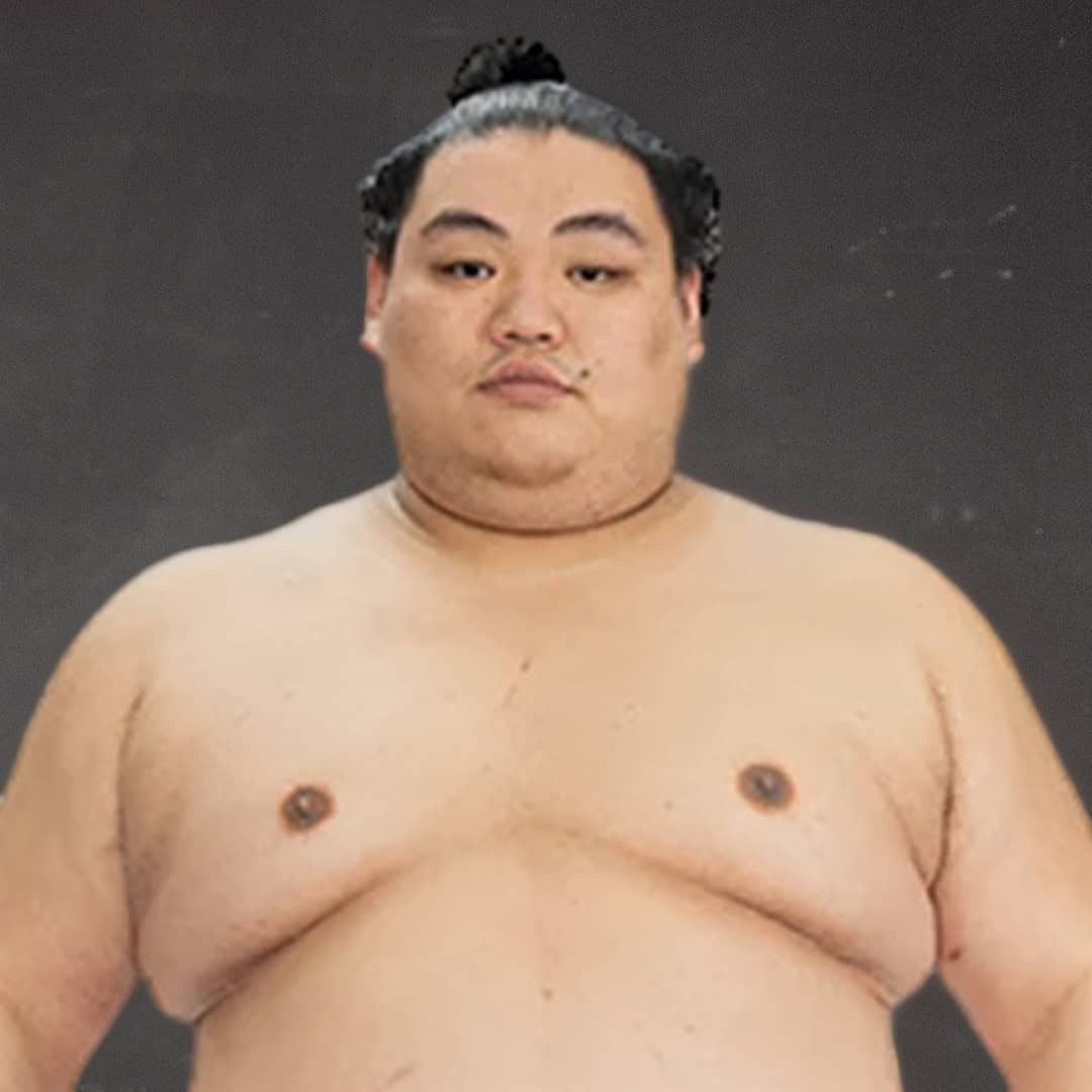 Sumo wrestler shirtless with black hair in a topknot.
